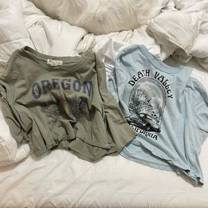 Two graphic crop tops